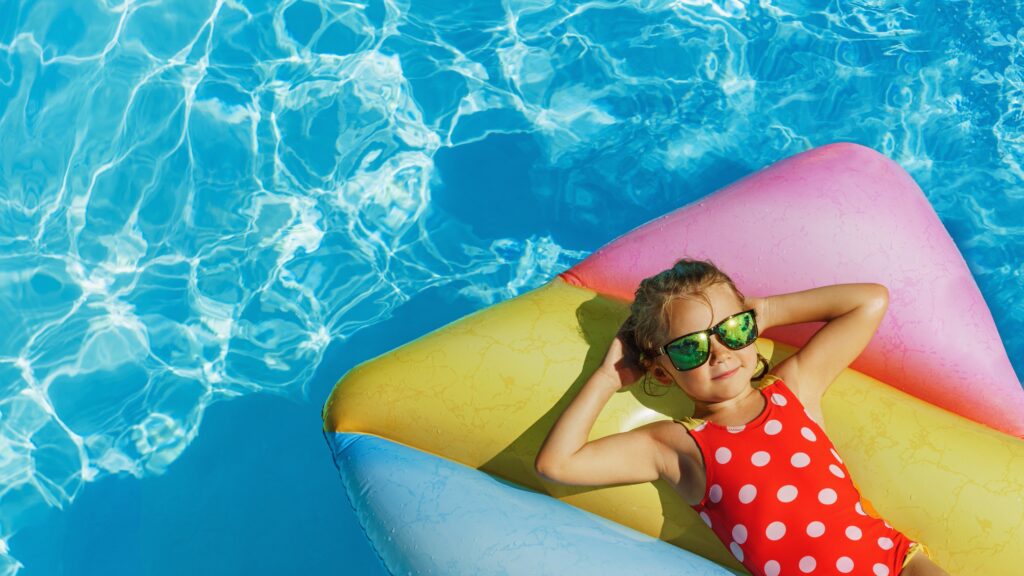 Child,In,Swimming,Pool.,Having,Fun,On,Vacation,At,The
