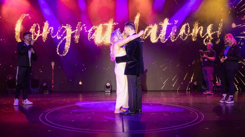 Image of Amy Hart and Sam Rason getting engaged on a cruise ship.
