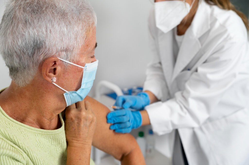 A lady receiving a flu vaccination