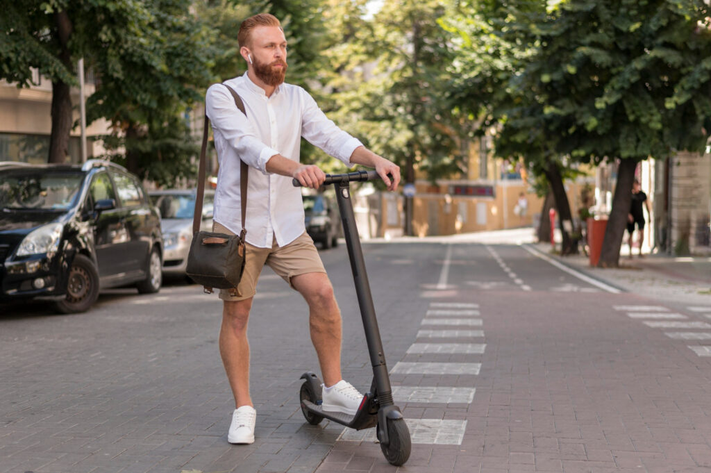 Man on electric scooter