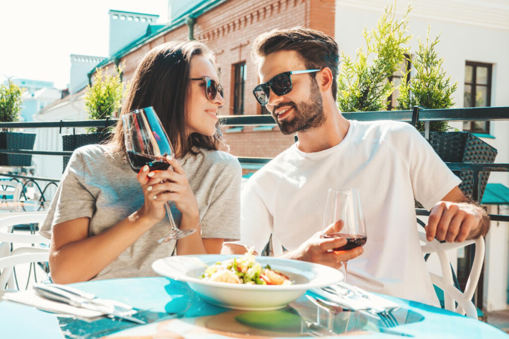 A couple enjoying a meal on a terrace
