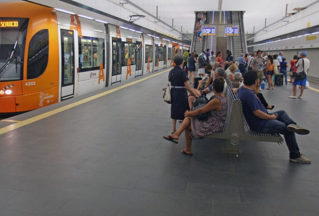 Passengers waiting at a tram station