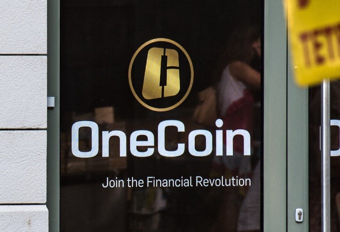 Image of OneCoin logo on the door of their office in Sofia, Bulgaria.