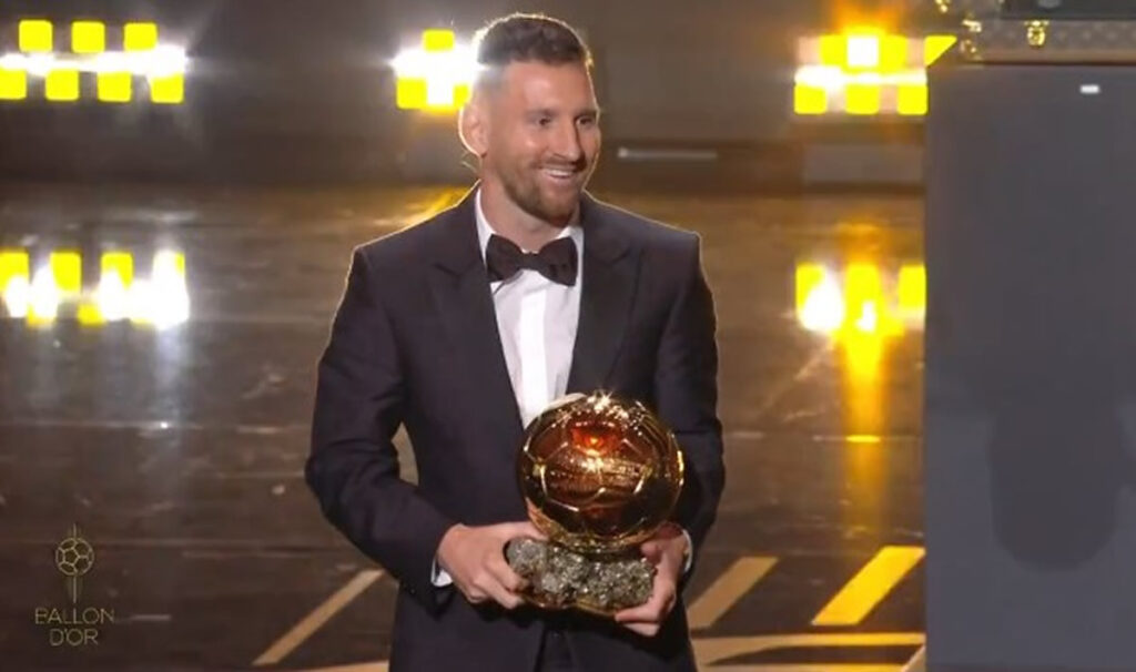 Image of Lionel Messi holding the 2023 Ballon D'or.