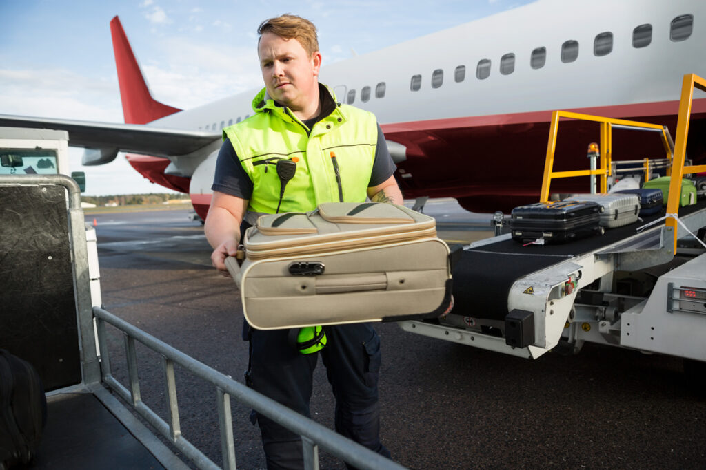 Image of an airport baggage handler.