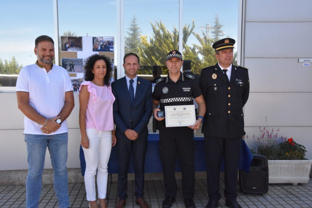 Dedicated service: Pinoso awards officer with Police Merit Cross.