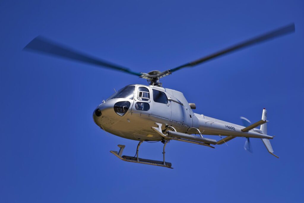Helicopter in a bright blue sky