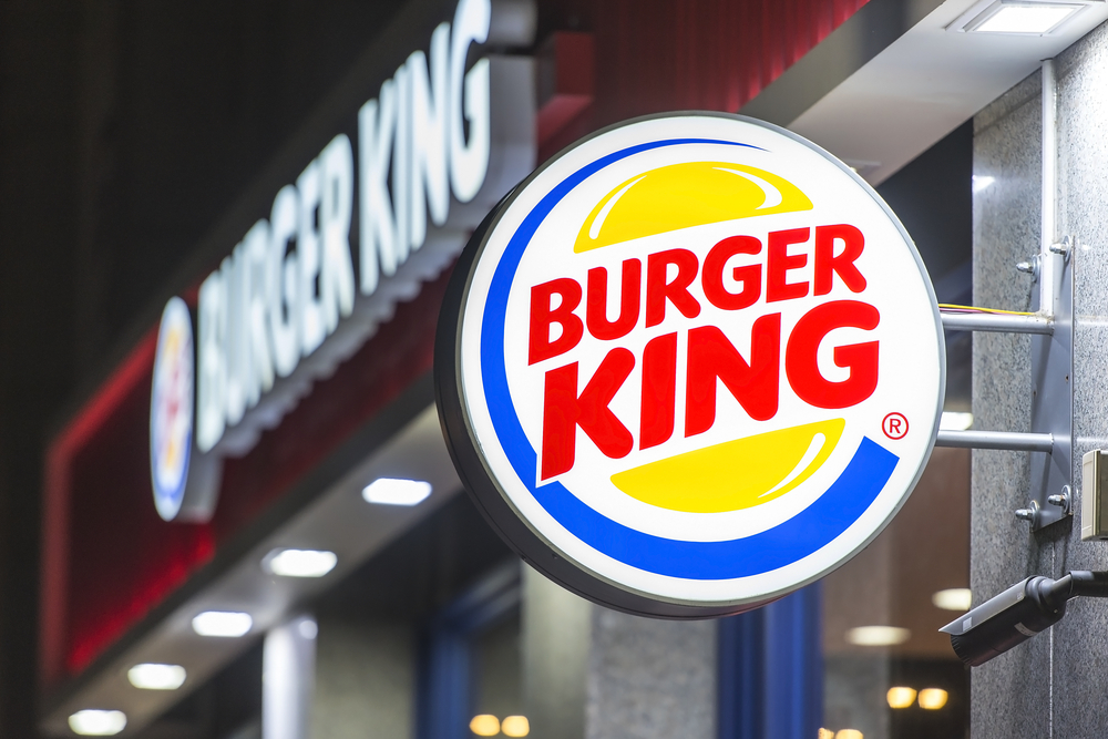 picture of the outside of a Burger King with the sign in the forefront