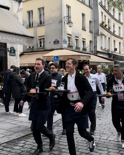 Promoting Olympic spirit: Parisian 'Waiter Race' returns after 13-year hiatus.