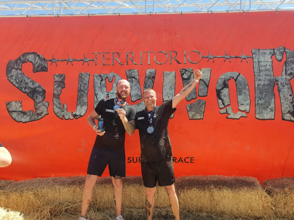 Michael Purdy and Philip Trower completing Alicante's Survivor Race for charity.