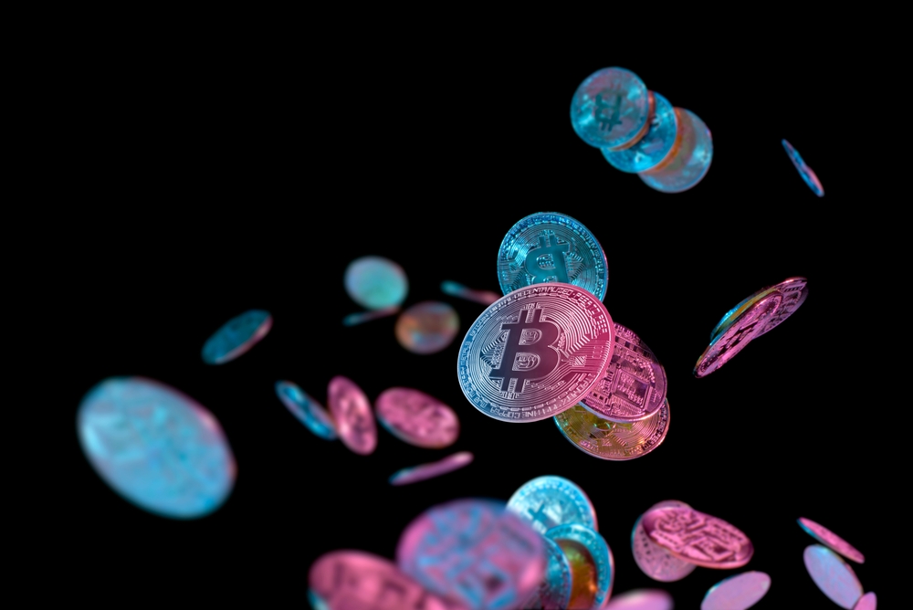 Falling bitcoins with blue & pink lighting