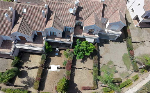 Aerial image of damage to gardens.