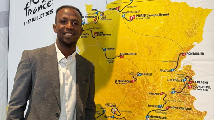 Photo of Eritrean cyclist Biniam Girmay, winner of a green jersey in 2024 with a map of Tour de France 2025