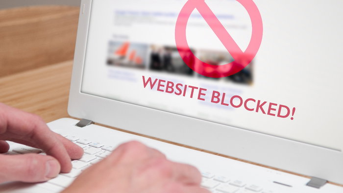 Photo of a computer screen with the words "Website blocked"