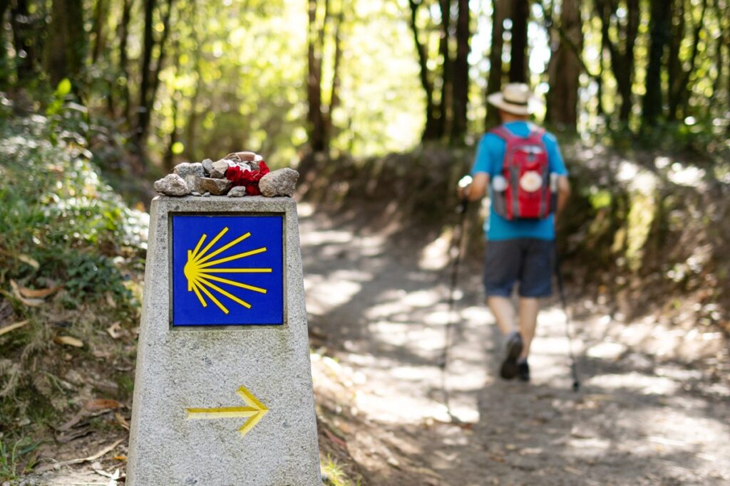 A yellow arrow waymark guiding pilgrims along the Camino de Santiago