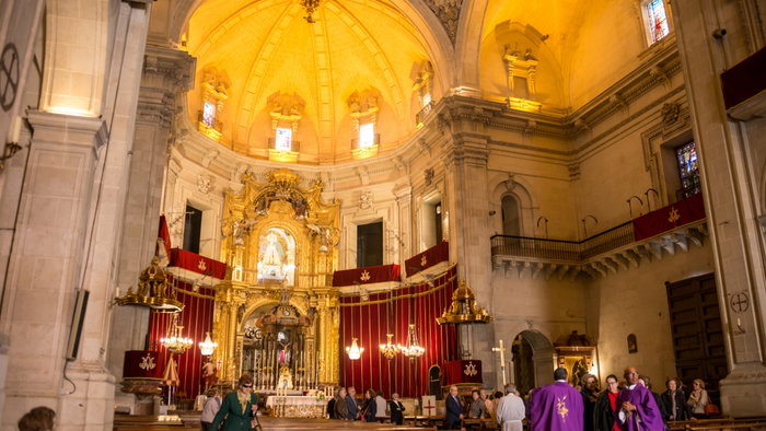 Valencian Community, Spain. Interior of the Basilica of Santa Maria de Elche with priests and parishioners in its corridors after a celebration. A group of Moroccan teens has been arrested for plotting an Elche Basilica attack before Christmas. 