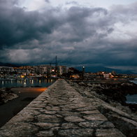 Storm clouds gather over Estepona harbour.