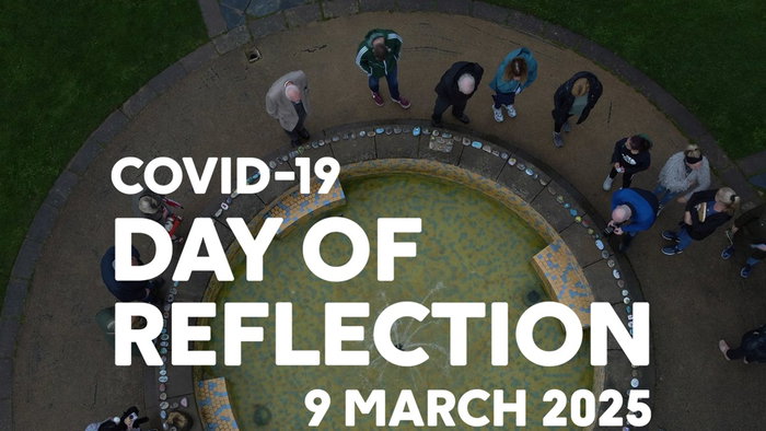 A group of people gathered around a circular memorial fountain, overlaid with the text “COVID-19 Day of Reflection, 9 March 2025,” symbolising a nationwide moment of remembrance
