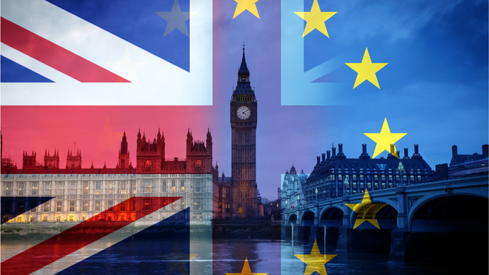 UK and EU flags overlaid on the Houses of Parliament in London,