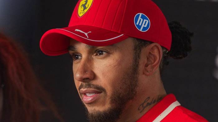 Lewis Hamilton wearing the Ferrari shield.