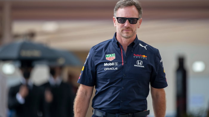 Christian Horner wearing Red Bull Racing team kit and sunglasses