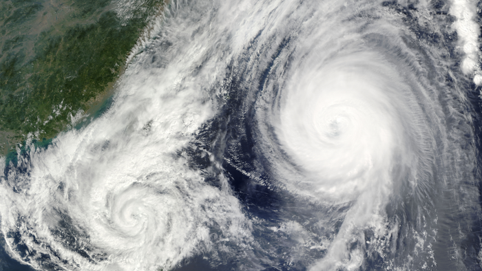 Satellite image of powerful storm system swirling over land and sea