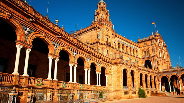 Seville’s Plaza de España glowing under autumn sunshine, a must-visit Spanish city in October.