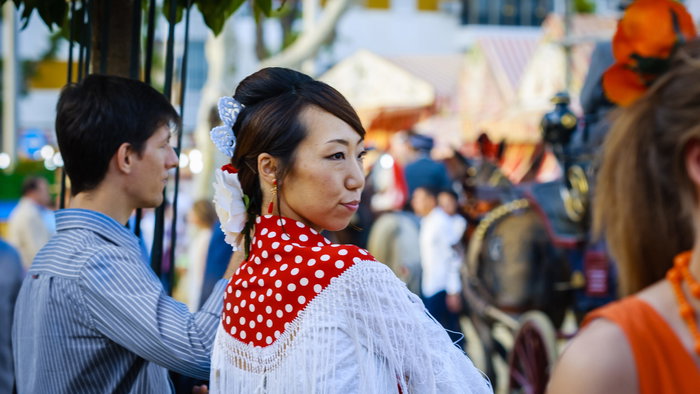 Japanese woman in Sevilla wearing traditional flamenco attire