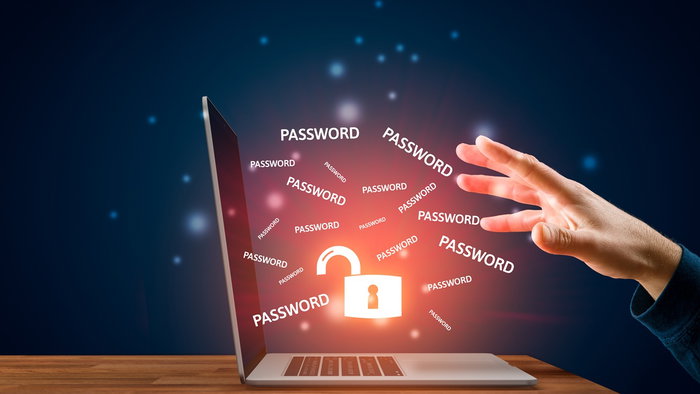 Computer screen showing exposed passwords and a broken digital lock symbol, illustrating a major data breach.