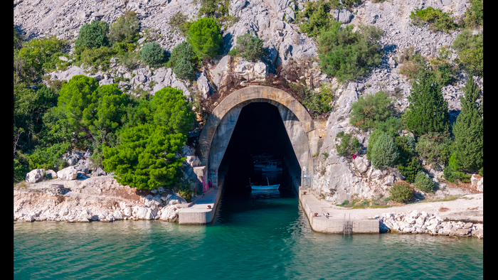 A tunnel in the mountain at the mouth of the sea for ships to pass