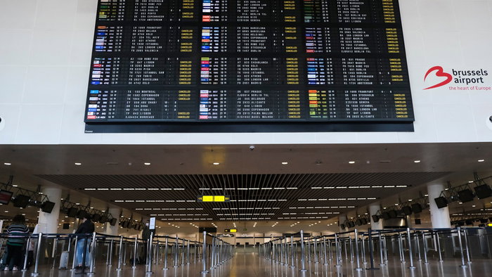 Departure board at Brussels Airport showing multiple cancelled flights during strike disruption.