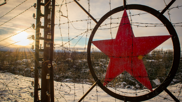 Soviet red star on a military base gate