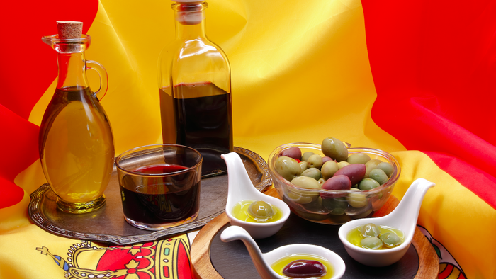 Olives and olive oil on a Spanish flag