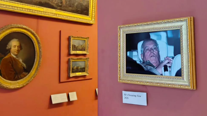 Photo in a frame hanging off a wall