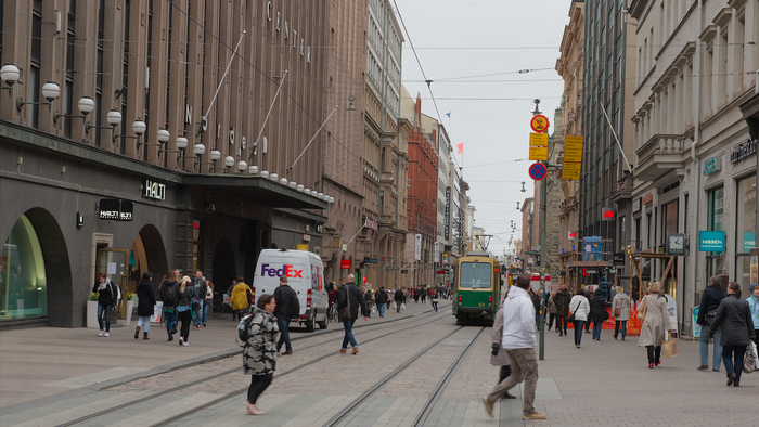 People walking down a street in Helsinki