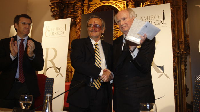 Men celebrating a prize giving