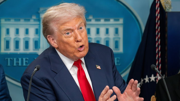 Donald Trump speaking during a public appearance amid controversy over plans to send a US hospital ship to Greenland