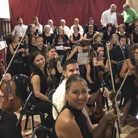 V16 emergency warning light flashing on top of a car stopped on the roadside in Spain.