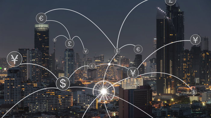 Money transfer icon over cityscape for banking concept background.