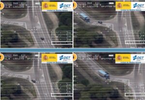 DGT aerial footage showing driver cutting into opposite lane at junction and forcing lorry to brake in Spain