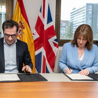 Rachel Reeves and Carlos Cuerpo sign documents in Madrid during an agreement to allow visa free travel and short term work between the UK and Spain.