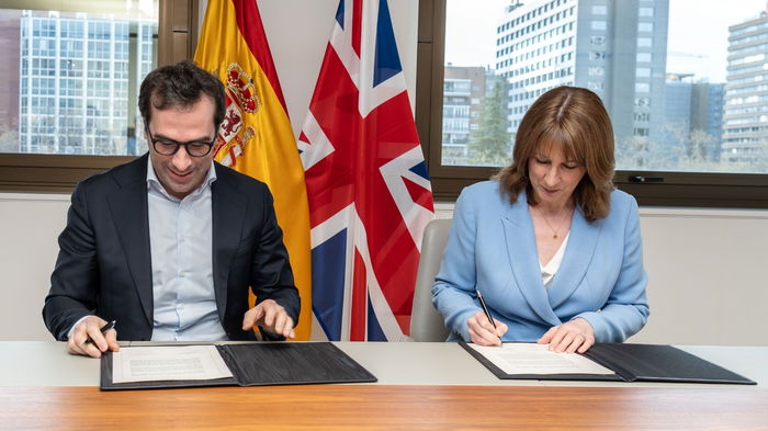 Rachel Reeves and Carlos Cuerpo sign documents in Madrid during an agreement to allow visa free travel and short term work between the UK and Spain.