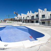 Swimming pool and housing complex being constructed.