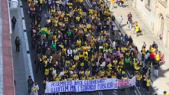 A street filled with people protesting.