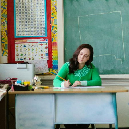 Woman sitting crossed legged with a laptop on her lap