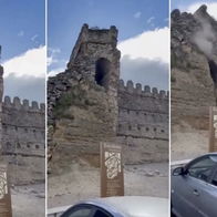 Medieval castle tower collapse narrowly misses passersby.