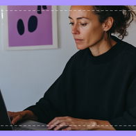 Woman on laptop scrolling through for ideas on web design