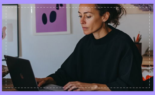 Woman on laptop scrolling through for ideas on web design