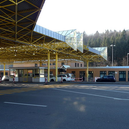Border crossing checkpoint between Germany and Switzerland with empty lanes and control booths
