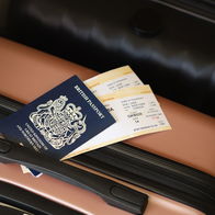 British passport and boarding pass on a suitcase ready for travel